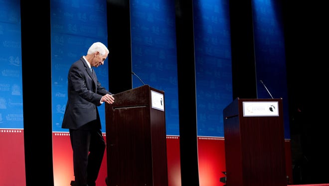 Democratic challenger Charlie Crist waits for Florida Gov. Rick Scott to start their second debate, Wednesday, Oct. 15, 2014 in Davie, Fla. Scott delayed the start of the debate because of an electric fan below Crist's podium. (AP Photo/Wilfredo Lee)