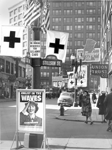 WWII signs and Red Cross flags at the intersection