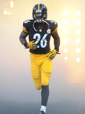 Pittsburgh Steelers running back Le'Veon Bell (26) takes the field before an NFL preseason football game against the Buffalo Bills on Saturday, Aug. 16, 2014, in Pittsburgh. Pittsburgh won 19-16.(AP Photo/Don Wright)