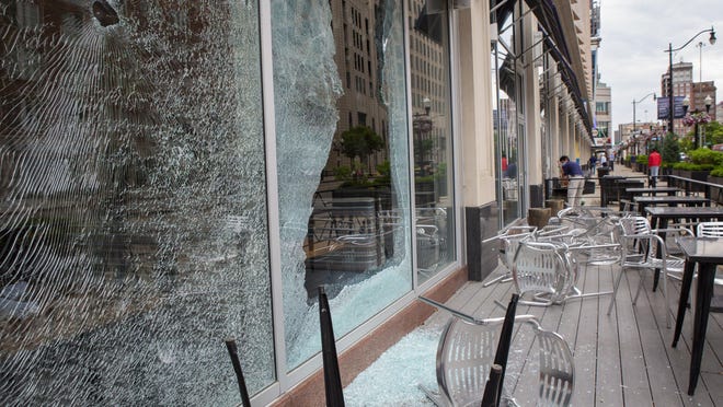 Broken windows on the Lazarus building Downtown can be seen the morning after protests in the streets of Columbus caused damage to many businesses on May 29.