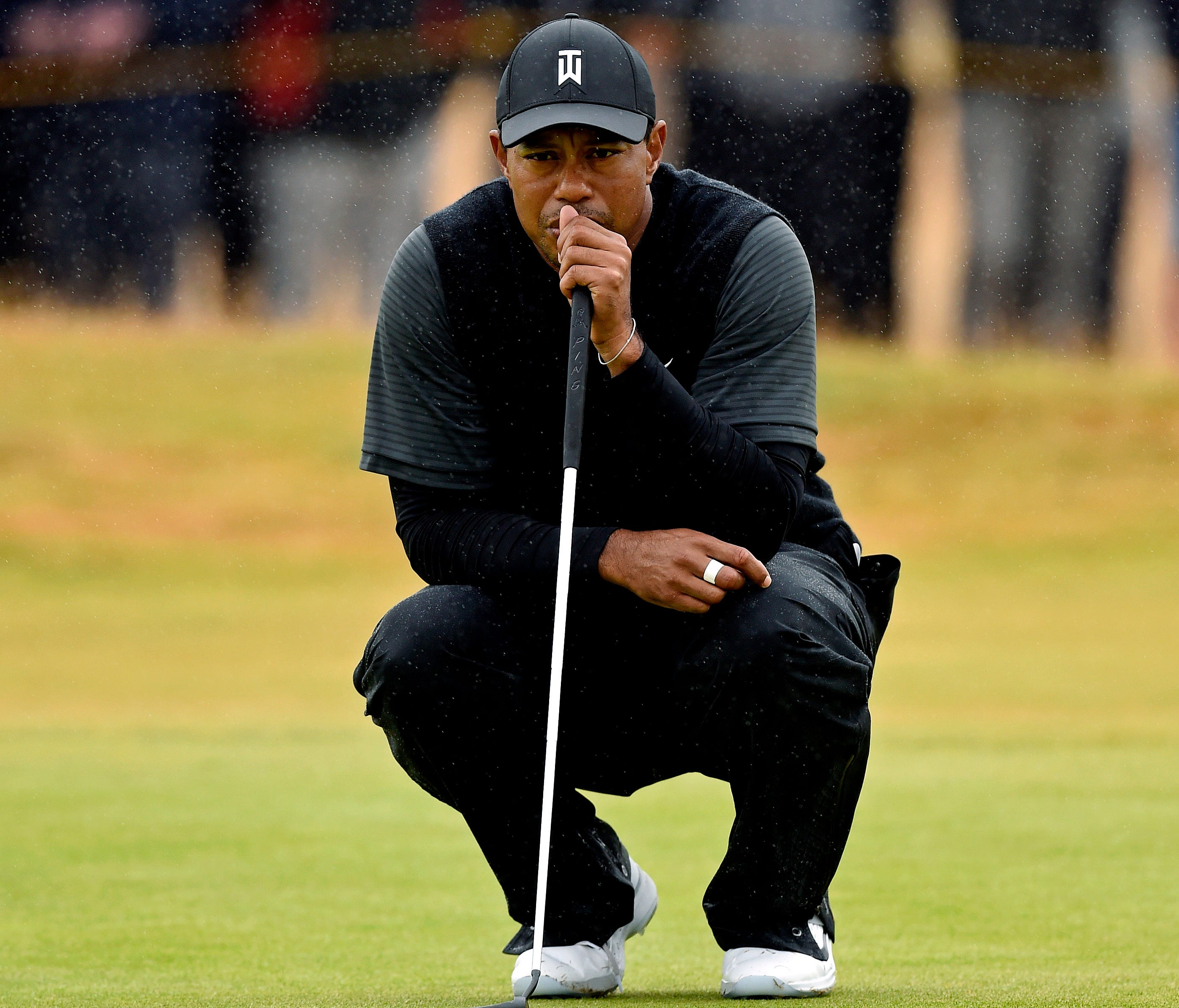 Tiger Woods lines up his putt on the fourth green during the second round of The Open Championship golf tournament at Carnoustie Golf Links.
