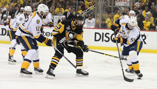 Pittsburgh Penguins center Nick Bonino, center, scored 37 points last season.