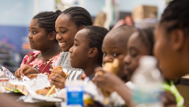 St. Lucie Public Schools students eat lunch and socialize at Northport K-8 at 250 NW Floresta Dr. in Port St. Lucie on Thursday, Sept. 14, 2017, on the first of two days the school district is providing free breakfast and lunch. At eight school sites, breakfast will be served from 8 to 9 a.m., and lunch from 11:30 a.m. to 12:30 p.m., for district students. More information can be found at www.stlucie.k12.fl.us and on the St. Lucie Public Schools Facebook page. 