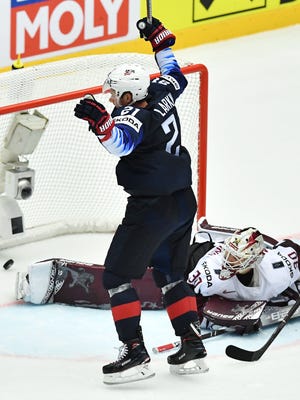 Dylan Larkin of the United States celebrates the winning goal in front of Latvia goalie Elvis Merzlikins during the group B match USA vs Latvia of the 2018 IIHF Ice Hockey World Championship in Herning, Denmark, on May 10, 2018.