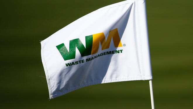 A Waste Management flag flies during the second round of the Waste Management Phoenix Open at TPC Scottsdale on Friday, February 5, 2016.