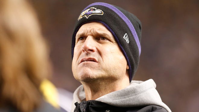 Michigan football coach Jim Harbaugh looks on from the sideline during a game between the Baltimore Ravens and Pittsburgh Steelers.