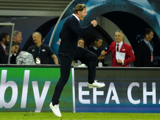 Leipzig coach Ralph Hasenhuettl celebrates after his team beats Porto 3-2 at the Champions League Group G first leg soccer match between RB Leipzig and FC Porto in Leipzig, Germany, Tuesday, Oct. 17, 2017. (AP Photo/Jens Meyer)