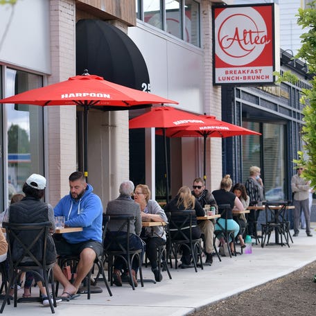 Diners along the sidewalk outside of Altea's Eatery on Park Avenue in Worcester.