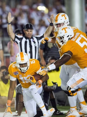 Tennessee wide receiver Jauan Jennings (15) is congratulated by offensive lineman Drew Richmond (51) and offensive lineman Brett Kendrick (63) in the Battle at Bristol on Saturday, September 10, 2016.