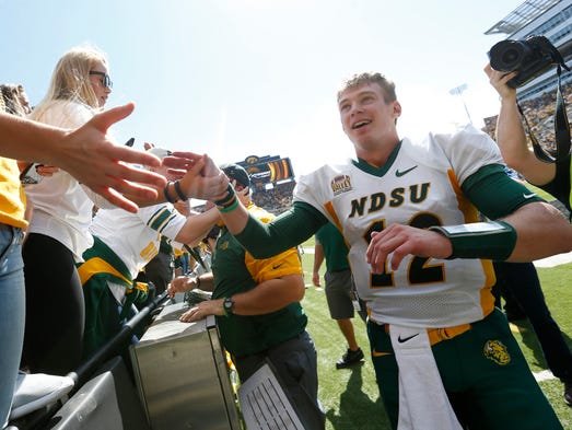 North Dakota State quarterback Easton Stick high fives
