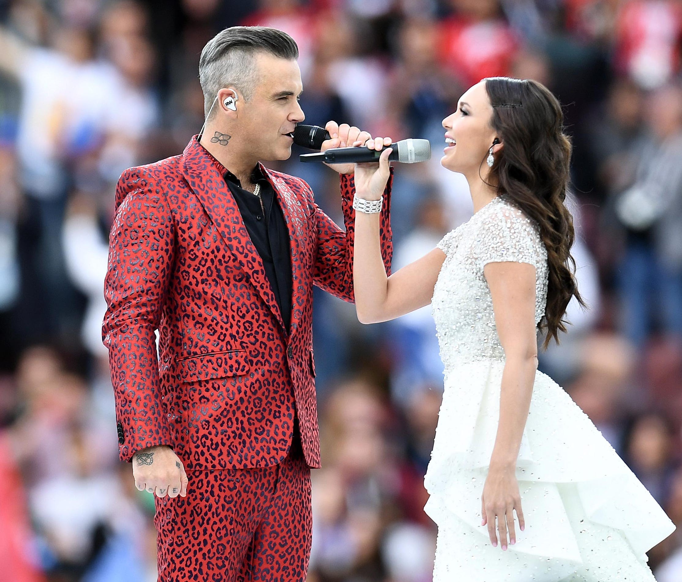 Recording artists Robbie Williams and Aida Garifullina perform during the World Cup opening ceremony.
