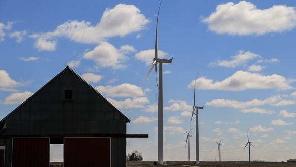 Wind turbines fill the horizon in O'Brien County Thursday,