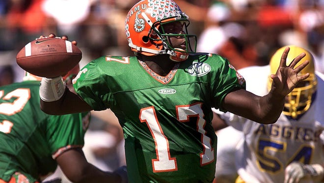 FAMU quarterback Quinn Gray looks downfield for a receiver during his playing days as the Rattlers’ record-setter. Gray was hired Thursday as Lincoln High School’s new head coach.