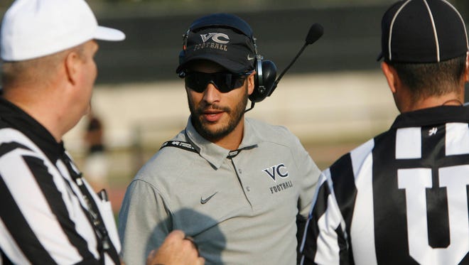 Ventura College offensive coordinator Daniel Algattas talks to referees before a scrimmage against L.A. Valley College. He is leaving Ventura to become head coach at San Bernardino Valley College.
