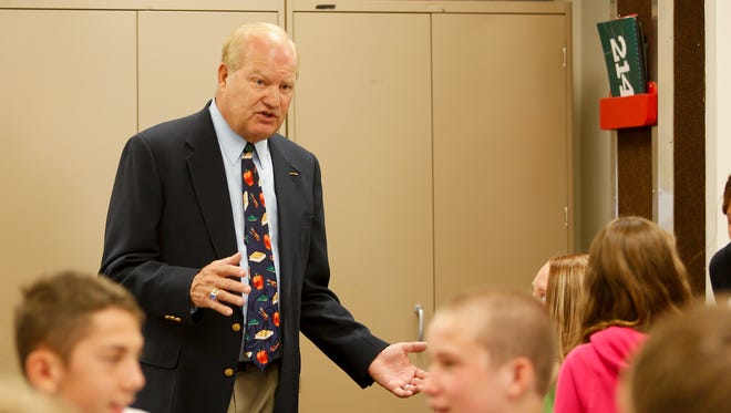 Fred Anderson, former North Middle School and Great Falls High principal, talks with students at North during class in 2012.