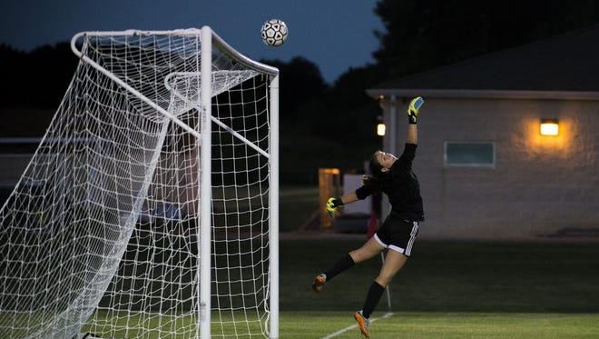 Vineland's Isabella Fiorenza leaps for a save as the ball soars over the goal Thursday in Millville.