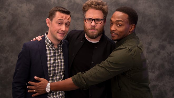 Joseph Gordon-Levitt (from left), Seth Rogen and Anthony Mackie star in the raunchy holiday comedy 'The Night Before.'