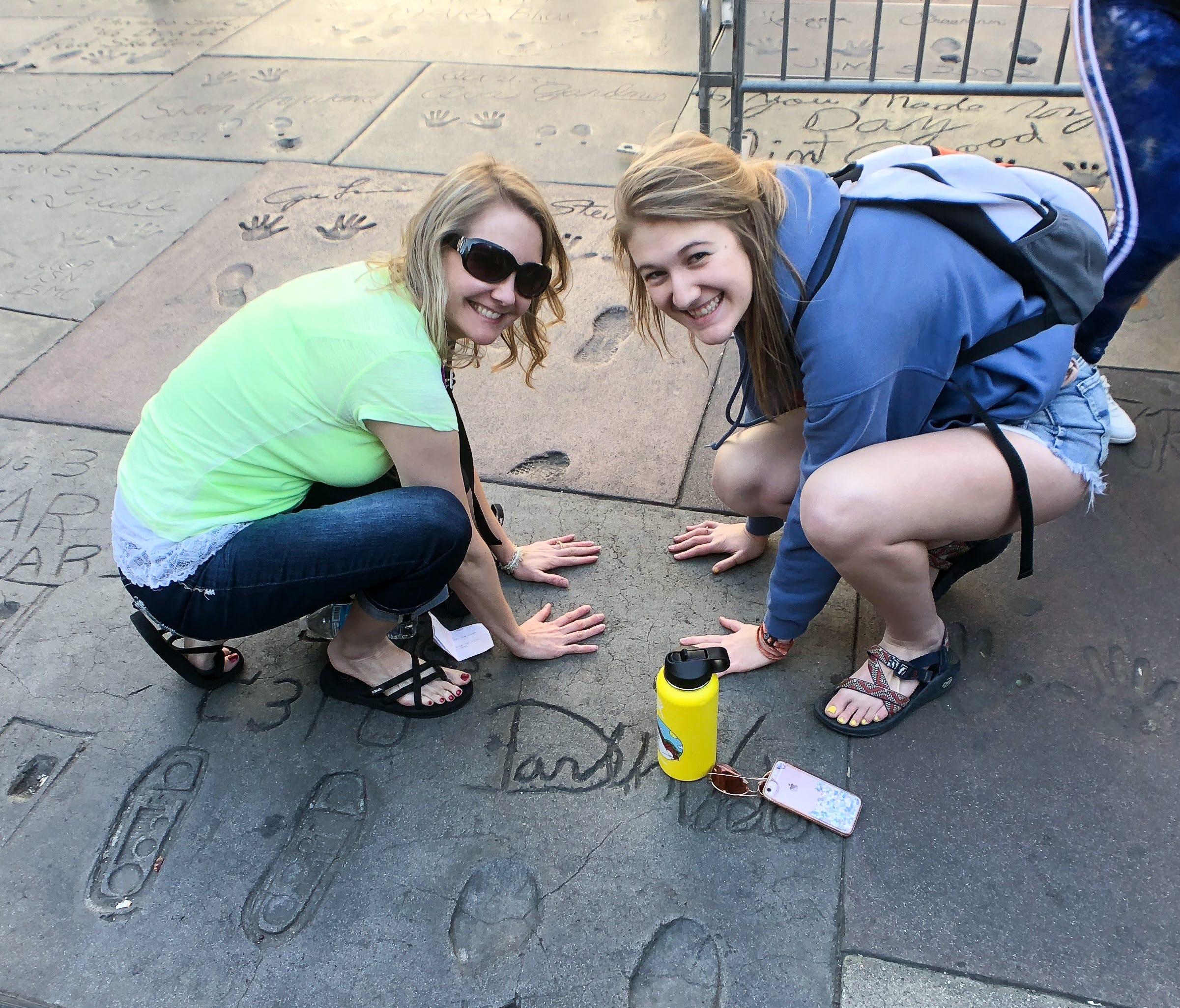 Chantell Kallas and daughter Kayley from South Dakota put their hands in the cement in front of the TCL Chinese Theater