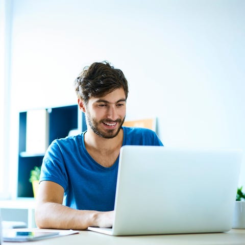 Smiling person at laptop