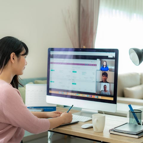 Person working at computer station.