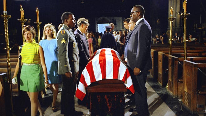 An honor guard stands over the casket of assassinated New York Senator Robert F. Kennedy in St. Patrick's Cathedral in New York, June 8, 1968.