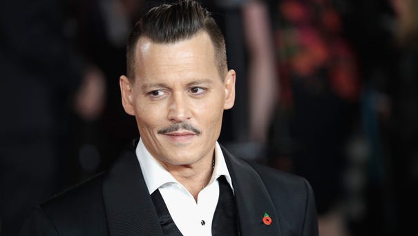 Johnny Depp sported a finely coiffed pompadour at...