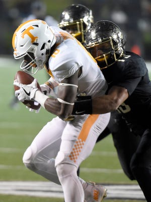 Vanderbilt safety LaDarius Wiley (13) stops Tennessee wide receiver Tyler Byrd (10)  in the closing minutes the game between Vanderbilt and Tennessee at Vanderbilt Stadium Saturday, Nov. 26, 2016, in Nashville, Tenn.