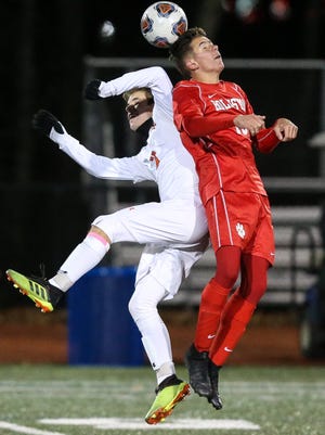 Wayland's Zach Campana (left) shown in the Division 3 state finals game against Holliston two years ago, scored two goals in the Warriors win over Weston on Saturday.