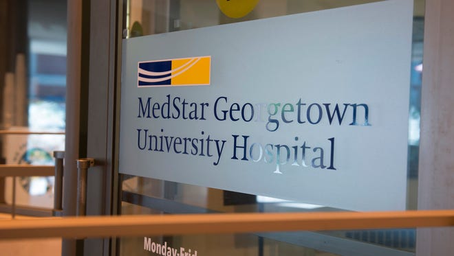 A sign covers the door to MedStar Georgetown University Hospital in Washington.
