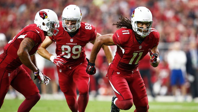 Cardinals Larry Fitzgerald, John Carlson and Michael Floyd break from the line against the Kansas City Chiefs on Sunday, Dec. 7, 2014 at University of Phoenix Stadium in Glendale.