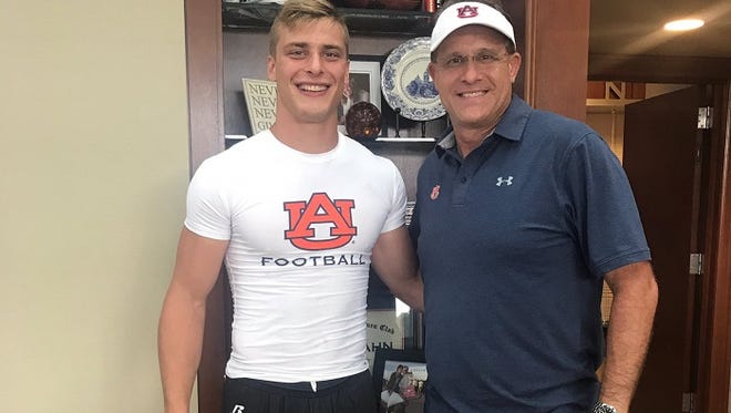 Josh Marsh, pictured here with Auburn coach Gus Malzahn following the Tigers prospects camp on July 21, became the ninth verbal commitment to Auburn's 2018 class. The three-star linebacker from Decatur (Ala.) High School led the state in tackles last season with 206.