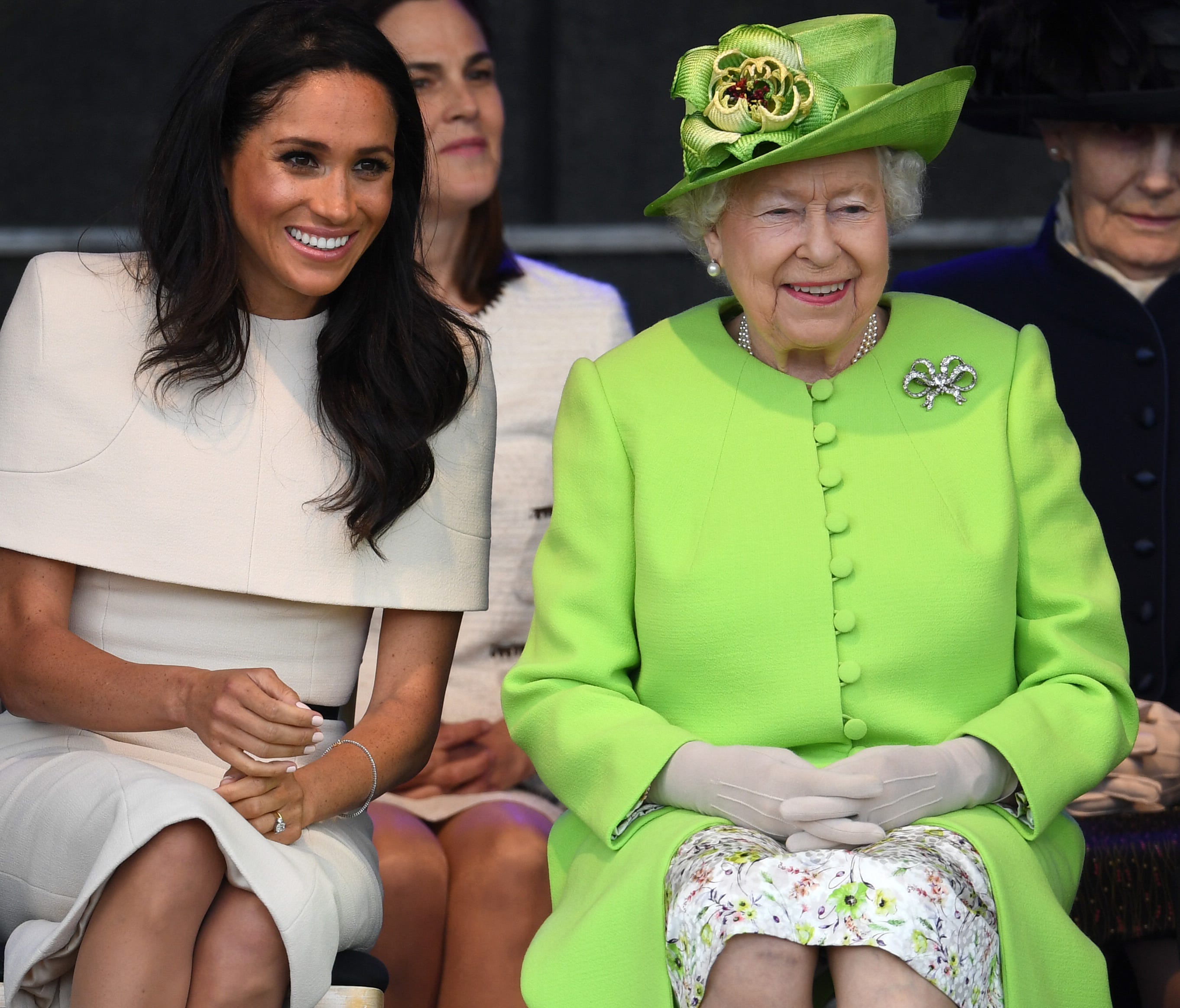 Queen Elizabeth II sits with Meghan, Duchess of Sussex during a ceremony to open the new Mersey Gateway Bridge on June 14, 2018 in the town of Widnes in Halton, Cheshire, England.