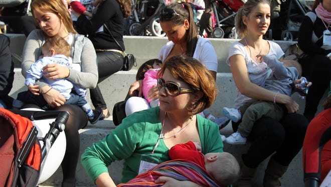Mothers breastfeed their babies during a celebration of World Breastfeeding Week 2013 in Thessaloniki, Greece.
