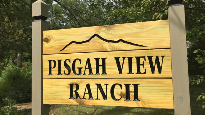The sign for the Pisgah View Ranch bordering the property in Candler. The property has been put up for auction beginning at $25 million.