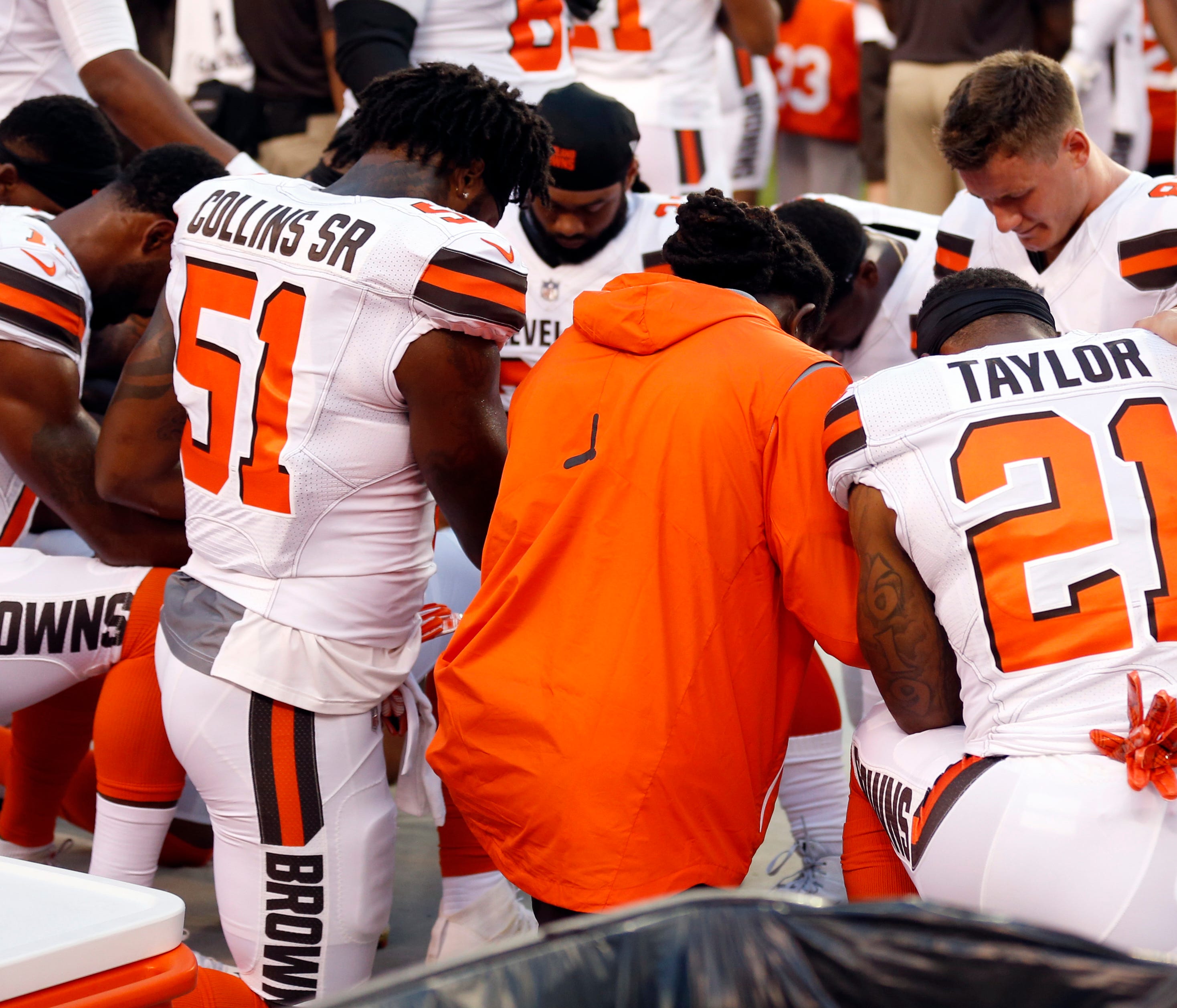 Members of the Cleveland Browns kneel during the national anthem before an NFL preseason football game between the New York Giants and the Cleveland Browns, Monday, Aug. 21, 2017, in Cleveland. (AP Photo/Ron Schwane) ORG XMIT: CDS10