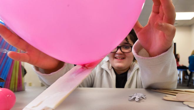 Anna Edges' flight of her Crew Exploration Vehicle (CEV) is aided by a balloon  at the Boys & Girls Club of Door County Wednesday, April 5, 2017.