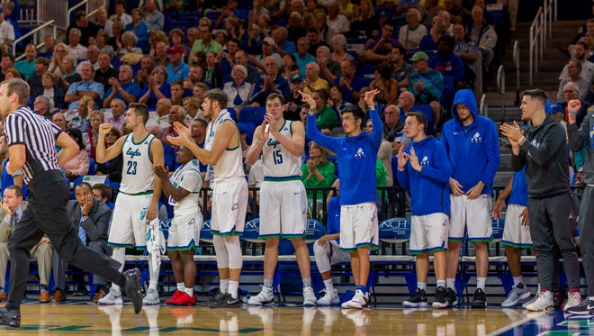 Junior forward Mark Matthews (sweatsuit, clapping foreground), a Fort Myers High alum, no longer is with FGCU. He had been a redshirting walk-on.