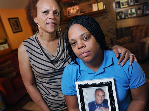 Allison King, right, and her mother, Barbara Jones, are coping with the loss of King's son, Darius Brent, on Aug. 15, 2013 in Jackson, Miss. His decomposed body was found under a house last week after being shot.