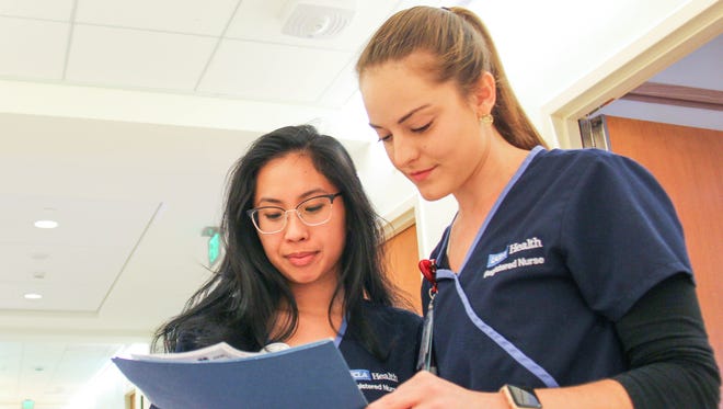 Travel nurse Lauren Bond (right) confers with nurse Megan Mamaril in the pediatrics unit at UCLA Medical Center, Santa Monica. Bond says she wishes more states accepted the multistate license, which makes it easier for nurses to cross state lines. “It would make things a lot easier — one license for the country and you are good to go,” says Bond, who recently started a job at UCLA Medical Center, Santa Monica.