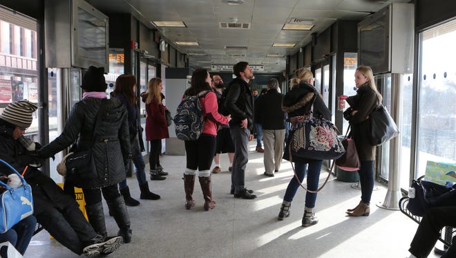 Young adults in the waiting room at the White Plains train station Saturday. Ridership by millennials on the weekends has increased.