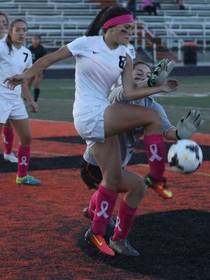 Aztec's Alycea Aviles tries to score against Farmington during their match on Thursday at Fred Cook Memorial Stadium in Aztec.