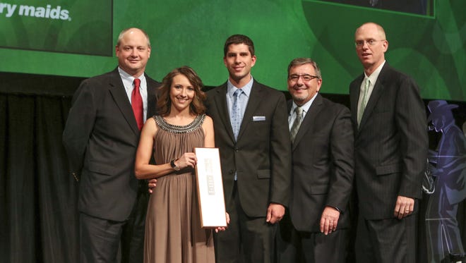 From left Marty Wick,President of service master F.S.G.; Maylene Bellon and Jared Bellon, local Merry Maids franchise owners, Joe Chaves, COO of Merry Maids, and Micah Newhouse, Merry Maids vice president of operations, pose at the company's national convention where the Ruidoso franchise was honored.