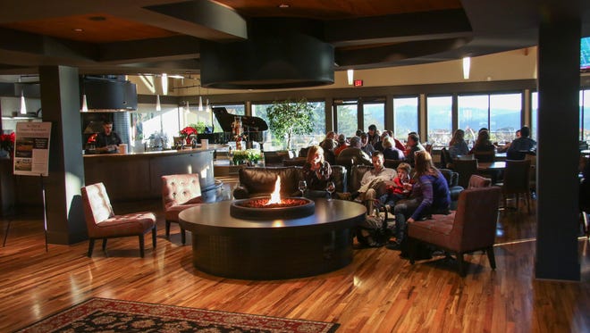 Visitors enjoy wine in the tasting room at Willamette Valley Vineyards in November 2015. Hit up the winery for Valentine's Day events.
