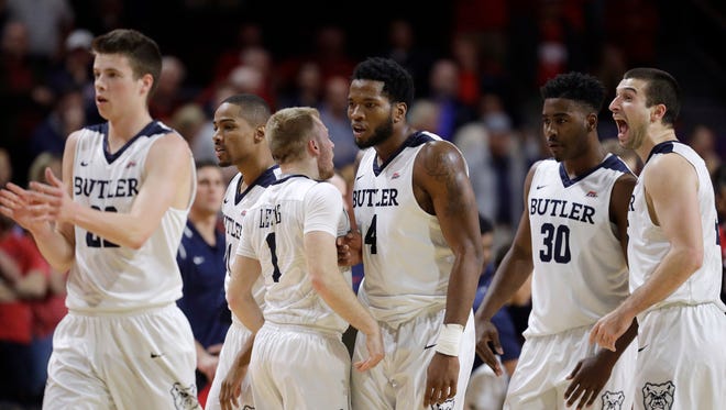 Butler players celebrate near the end of an NCAA college basketball game against Arizona on Friday, Nov. 25, 2016, in Las Vegas. Butler won 69-65. (AP Photo/John Locher)