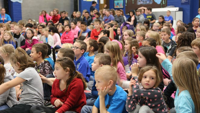 Washington County School District students listen to state politicians and Utah Educational Savings Account officials during an assembly in this file photo from Dec. 2016.