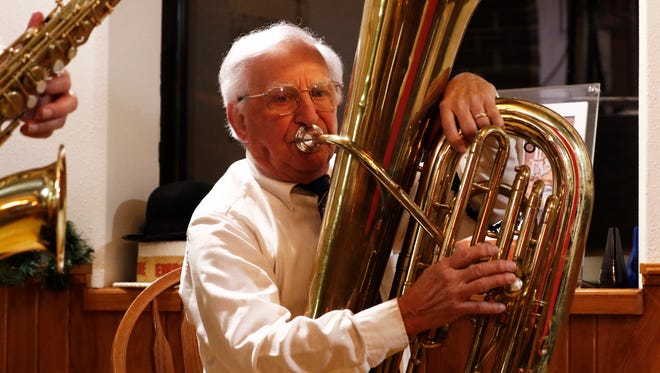 Ted Goeden, of Weston, plays a tuba Wednesday night for a documentary video at Bull Falls Brewery in Wausau.