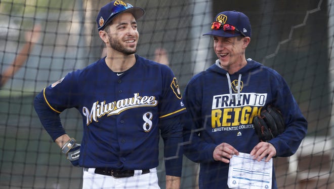 Brewers manager Craig Counsell talks to Ryan Braun during a spring training workout last month.
