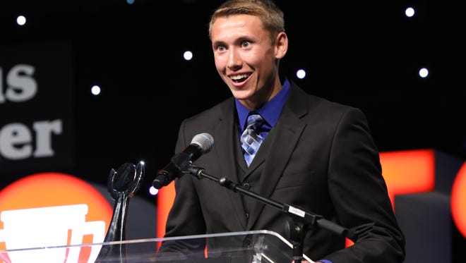 Derick Peters of West Central accepts the Boys Cross Country Runner of the Year award on Saturday at the Argus Leader Sports Awards at the Pentagon.