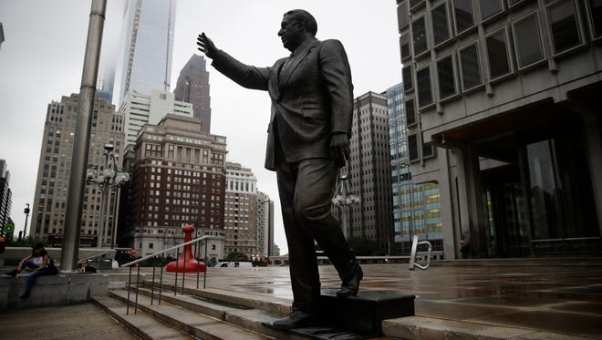 Shown is a statue of the late Philadelphia Mayor Frank Rizzo, who also served as the city's police commissioner outside the Municipal Services Building in Philadelphia on Friday. Late Thursday, someone spray painted "Black Power" on the statue.