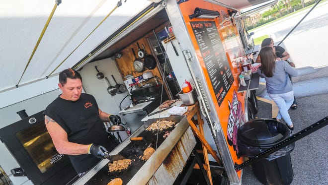 SWFL Hunger Games, a food event at Six Bends Harley Davidson that gets food trucks, chefs and restaurants competing to raise money for Blessings in a Backpack. One of the food trucks, Currie's Smokin Hot BBQ will be one of the truck at the event. Tim Currie, co-owner, cooks up lunch Thursday afternoon. 
